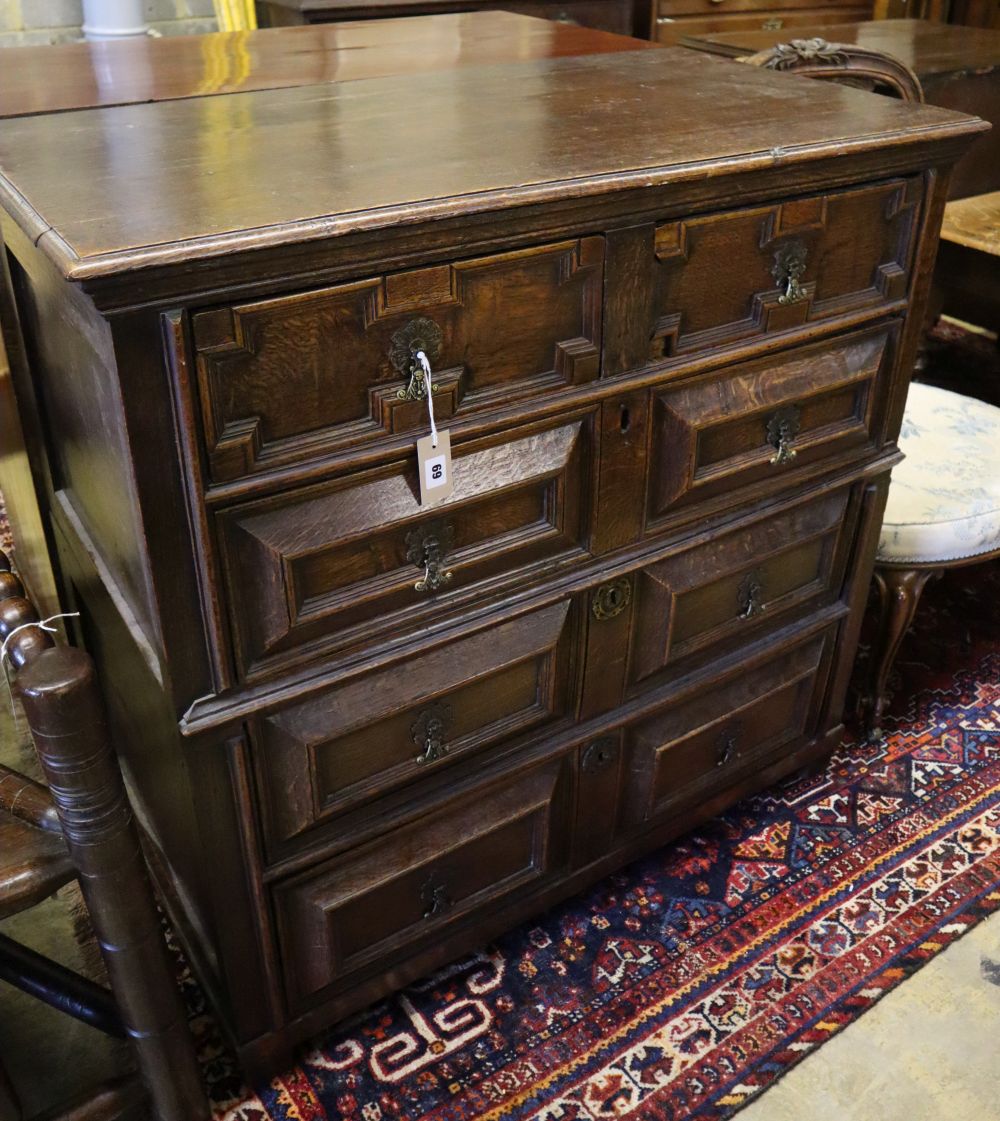 A late 17th century oak chest fitted four geometrically-moulded drawers on block feet, width 108cm depth 56cm height 104cm